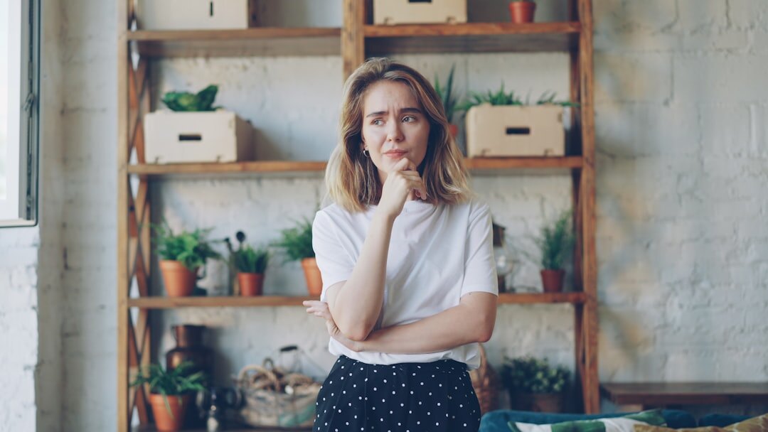 Portrait of a friendly young woman community manager smiling