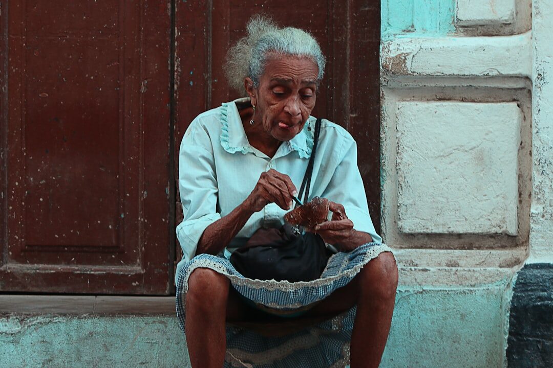 elderly woman knitting