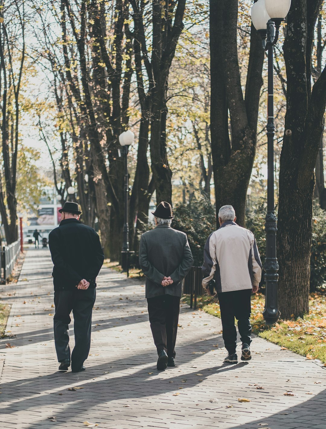 elderly people walking in park