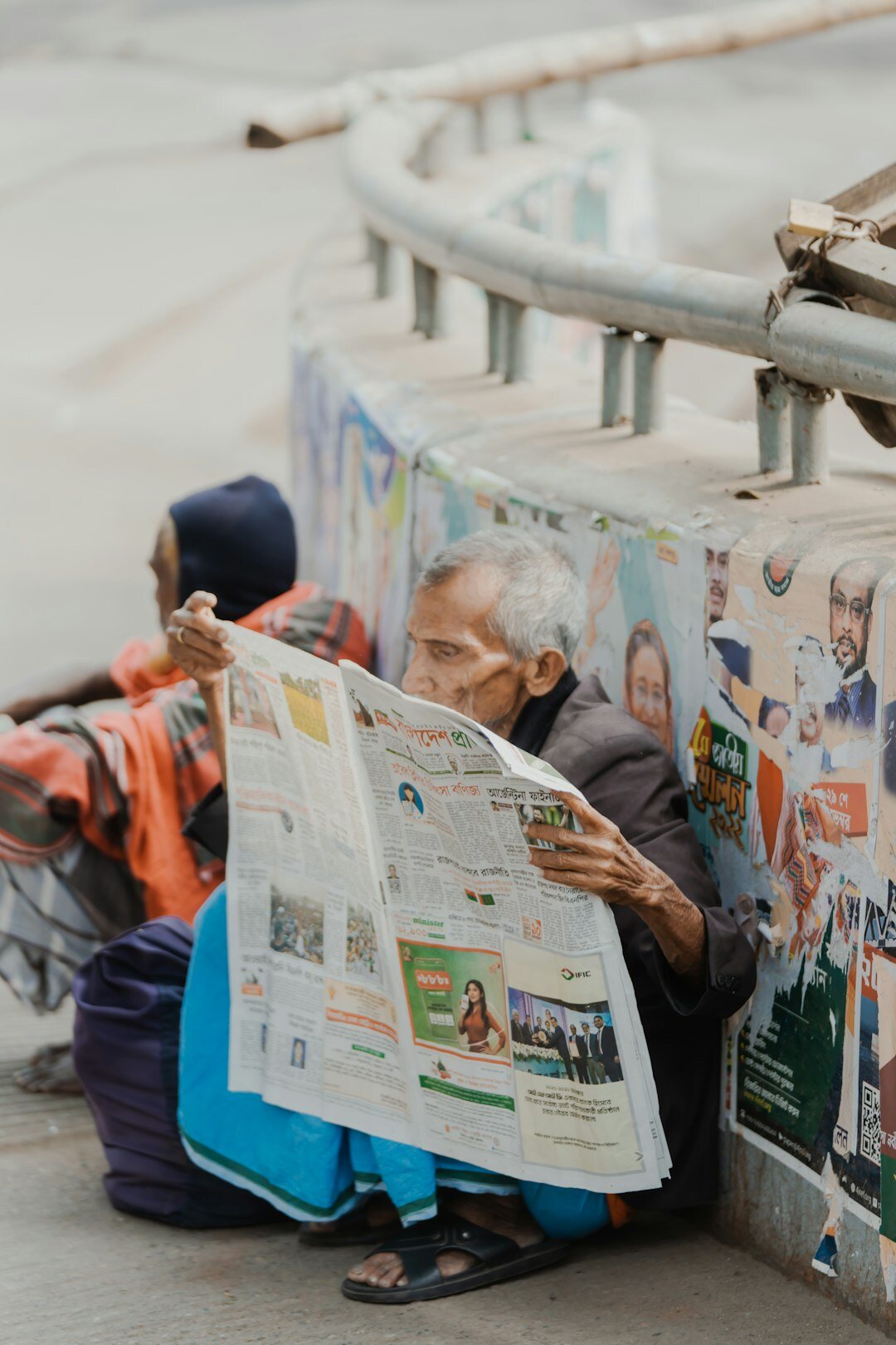 senior couple reading newspaper