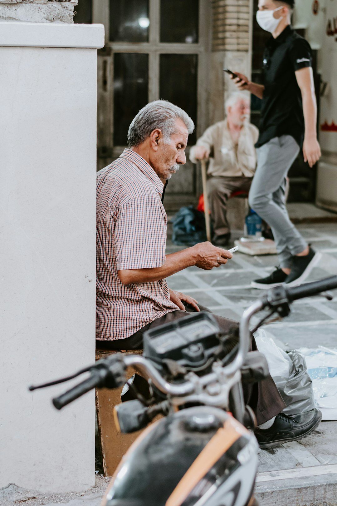 elderly man checking documents