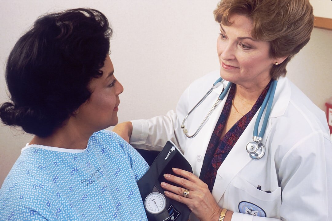 doctor checking elderly patient