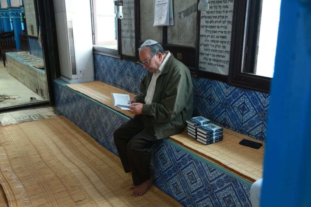 elderly man reading book